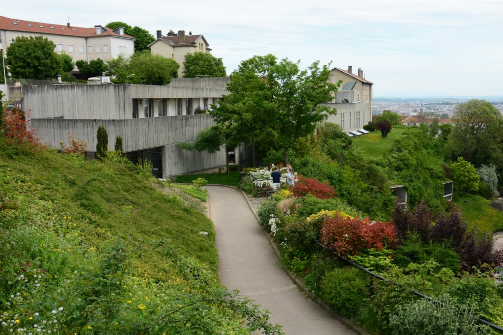 themuseumofantiquitiesadjacenttotheamphitheaterswasdesignedbyberbardzehrfussnoticethetwolargewindowsinthehillsideattheright.jpg